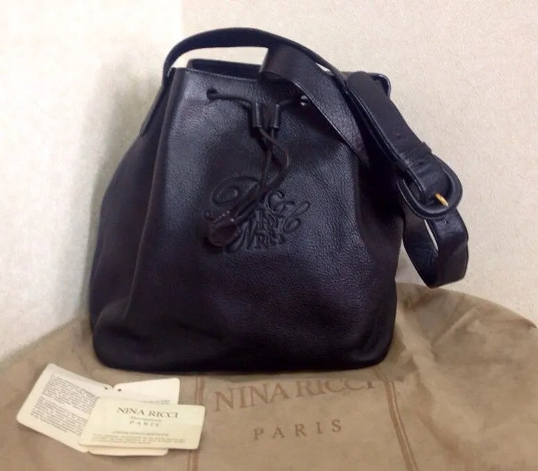 Vintage Nina Ricci genuine black leather classic hobo bucket shoulder bag with embossed logo. Maroquineri collection. Made in Italy